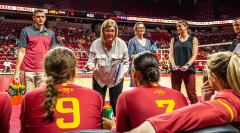 Iowa State volleyball head coach Christy Johnson-Lynch talks with the Cyclones during a timeout against TCU on Sept. 25.
