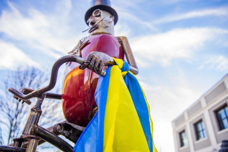 A+Ukrainian+flag+was+tied+to+a+statue+in+downtown+Ames+during+a+protest+on+Feb.+27.