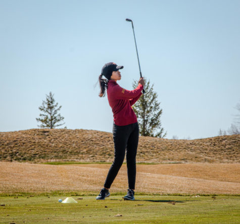 Liyana Durisic watches as her shot approaches the green April 5 at the Cyclone Sports Complex.