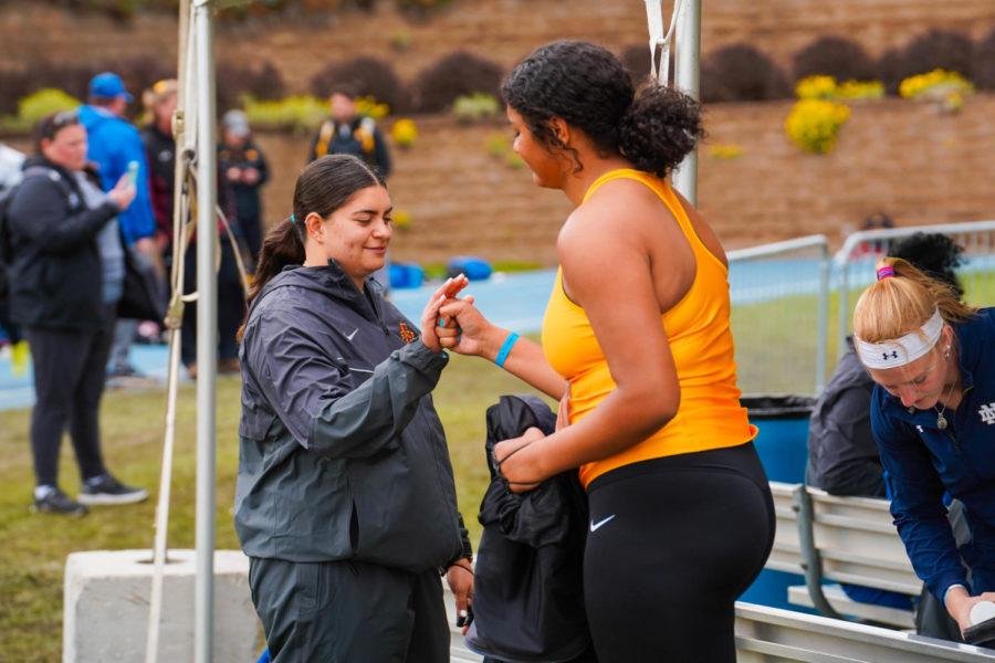 Senior Antonella Creazzola (left) congratulates her teammate Danielle Hoyle during the womens hammer throw at the Drake Relays on April 30, 2022 in Des Moines. Creazzola finished ninth overall in the hammer and broke her personal best in the process with a throw of 199 feet, 10 inches.