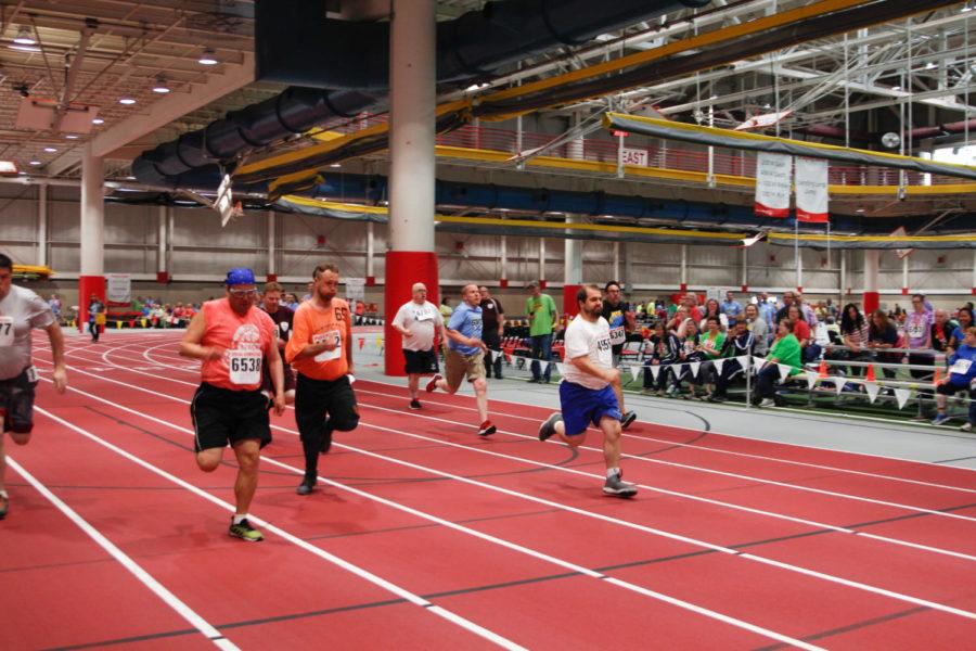 Special Olympics athletes participate in the 100m dash event at the Lied Recreation Center. 