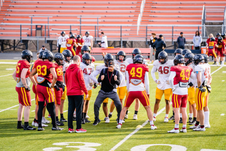 football during a spring practice April 1 at Ames High School.