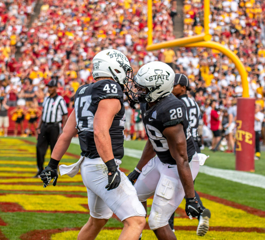 Jared Rus (left) and Breece Hall (right) celebrate after Halls rushing touchdown against No.10 Iowa on Sept. 11.