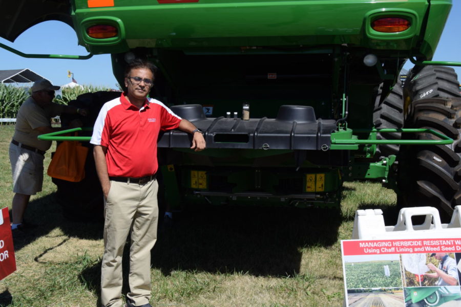 Prashant Jha, professor in agronomy, showcased the Weed Seed Destructor at the farm progress show explaining how it works to pulverize unwanted seeds.