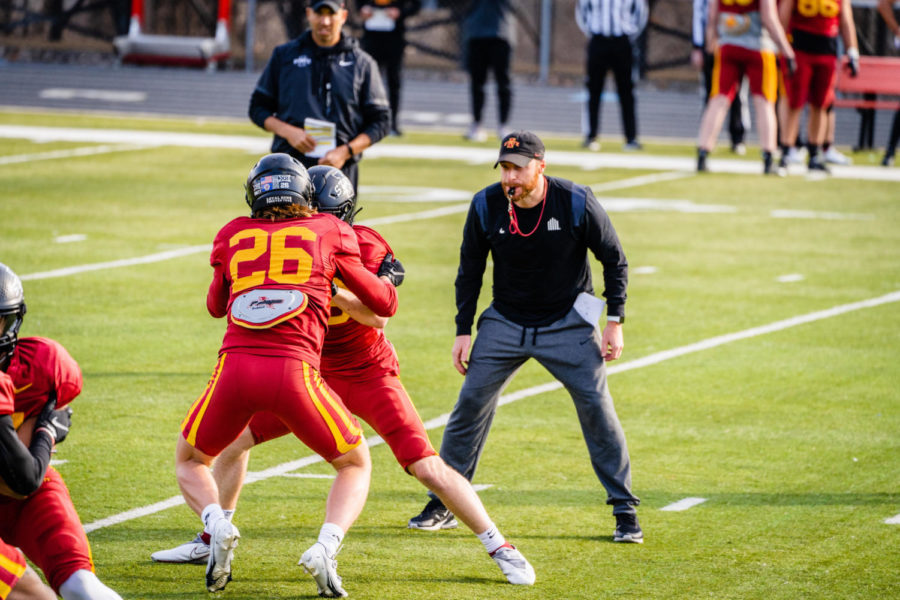 Iowa State cornerbacks coach Matt Caponi runs drills during a spring football practices April 1, 2022 at Ames High School. 