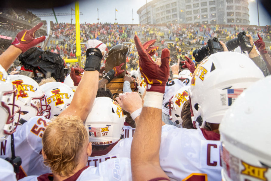 Iowa State celebrates with the Cy-Hawk trophy after beating Iowa on Sept. 10