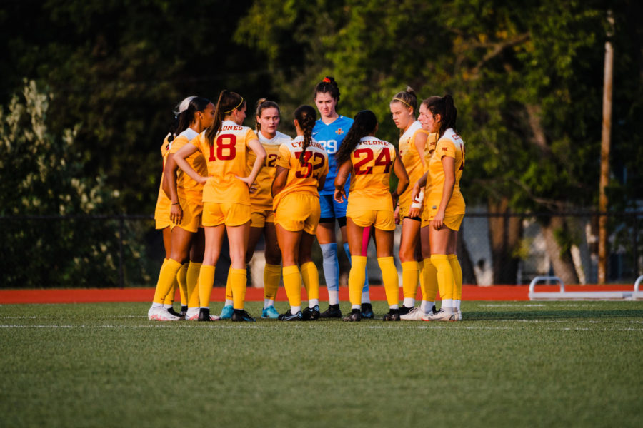 Cyclone teammates gather in a huddle during their game against Omaha on Sept. 15