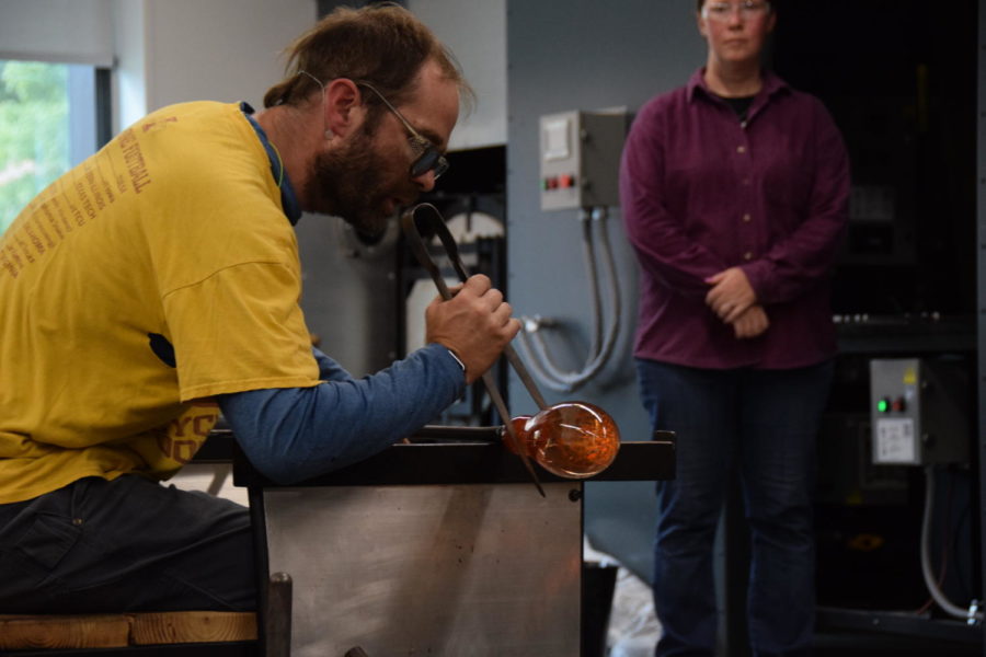 Micheal Skinner pictured while demonstrating his glass blowing skills at the Student Innovation Center.
