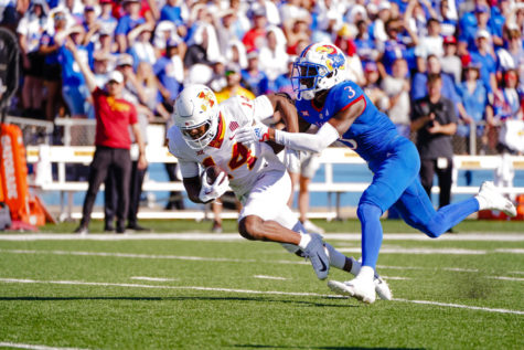 Cyclone Dimitri Stanley pushes through a Kansas tackle on Oct. 1