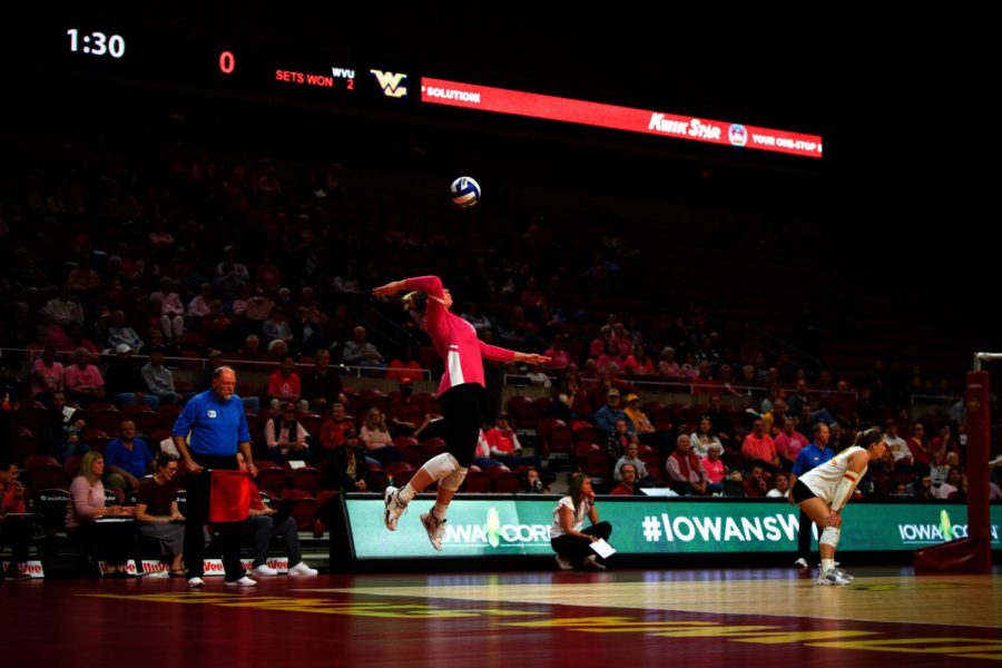 Spectators watch as Cyclone goes for serve against West Virginia on Oct. 18.