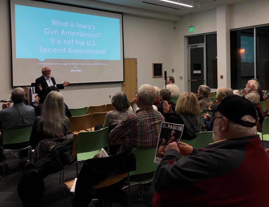 John Klaus, former Ames city attorney, presents on the gun amendment Iowa voters will see on the ballot Nov. 8. About 50 people were in attendance.