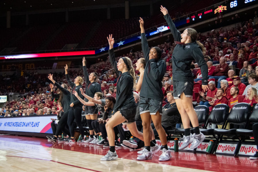 The Iowa State bench erupts in celebration after a three was scored in the game against Columbia University on Nov. 20, 2022.