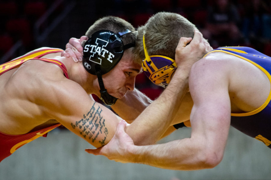 ********* takes on a wrestler from UNI in the Harold Nichols Cyclone Open on Saturday Nov. 26, 2022.
