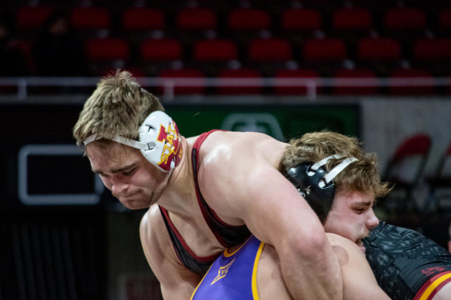 Rowan Udell gets lifted up by a wrestler from UNI in the Harold Nichols Cyclone Open on Saturday Nov. 26, 2022.