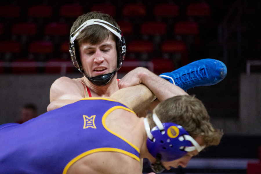 ********* lifts the leg of a wrestler from UNI in the Harold Nichols Cyclone Open on Saturday Nov. 26, 2022.