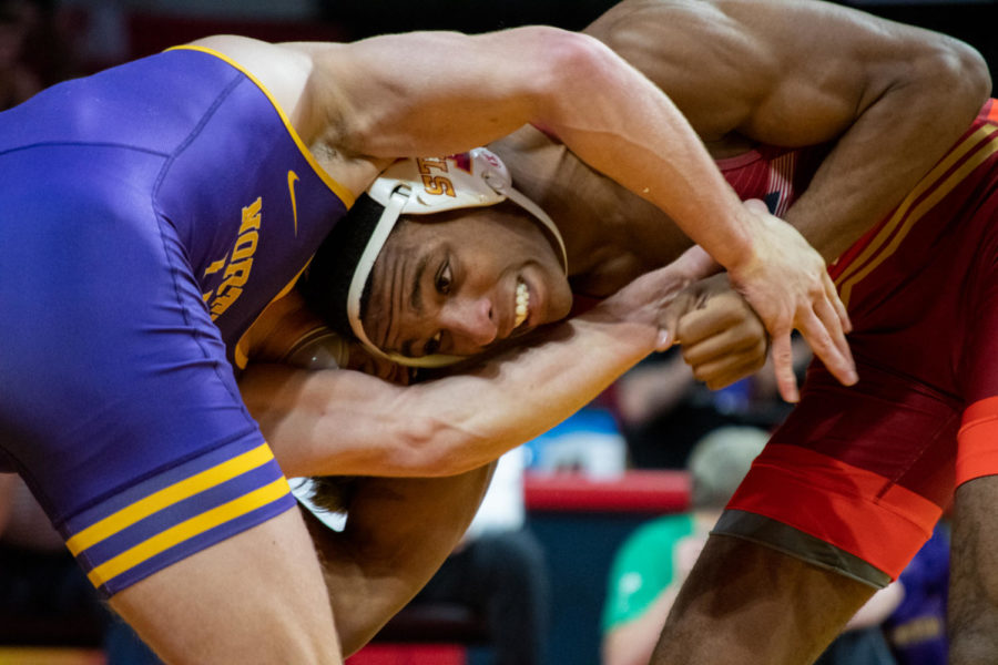 Cam Robinson comes head-to-head with a wrestler from UNI in the Harold Nichols Cyclone Open on Saturday Nov. 26, 2022.