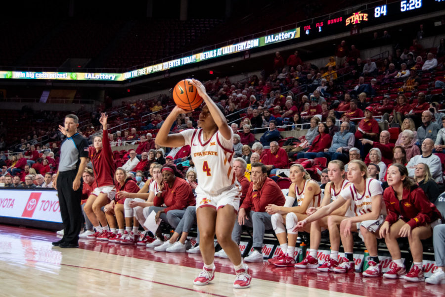 Shantavia Dawkins prepares to attempt a three in front of her teams bench in the game against SIUE in Hilton Coliseum on Tuesday Nov. 29, 2022.