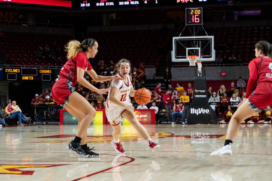 Mary Kate King attempts to drive past a defender in the game against SIUE in Hilton Coliseum on Tuesday Nov. 29, 2022.