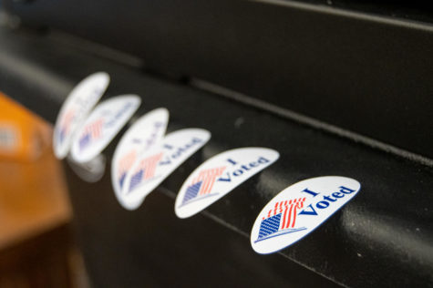 "I Voted" stickers dangle off of the ballot machine in Buchanan Hall on Tuesday Nov. 8, 2022.