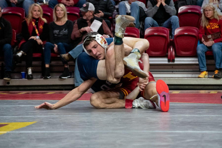 Iowa States Zach Redding gets caught in the legs of California Baptists Hunter Leake during the match on Saturday Nov. 12, 2022.