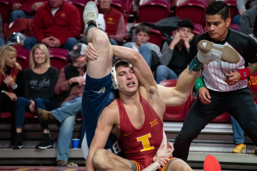 Iowa States Zach Redding gets caught in the legs of California Baptists Hunter Leake during the match on Saturday Nov. 12, 2022.
