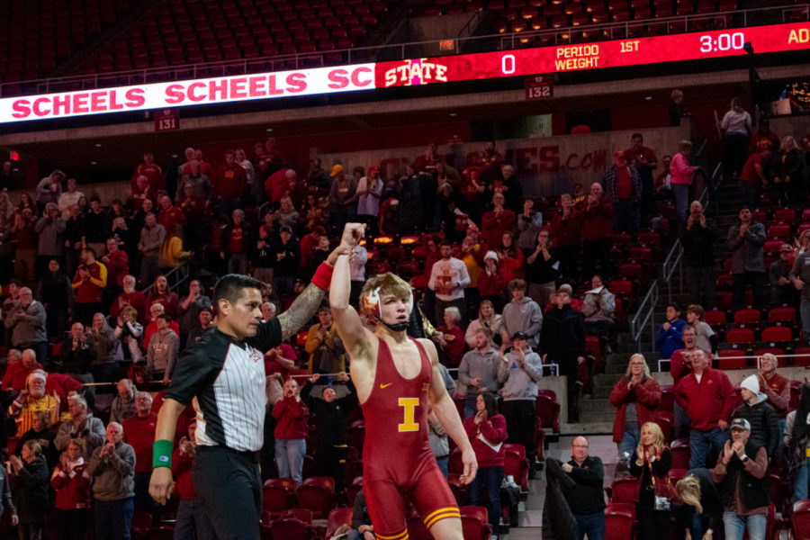 Iowa States Casey Swiderski gets his arm raised after winning his match against California Baptists Edison Alanis on Saturday Nov. 12, 2022.