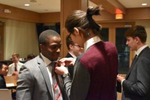 Jeremy Onyango receives his Triangle fraternity pin. Courtesy of Quinn Moran. 