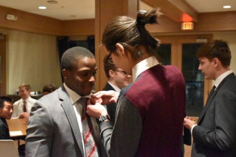 Jeremy Onyango receives his Triangle fraternity pin. Courtesy of Quinn Moran. 