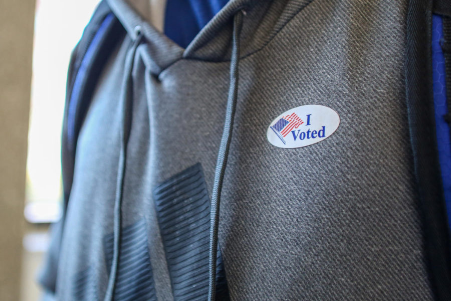 Alonso Gutierrez de Velasco poses for a photo with his I Voted sticker at Maple Residence Hall on Tuesday Nov. 8, 2022. 