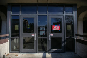 A sign outside of Maple Residence Hall reads "Voting Location" on Tuesday Nov. 8, 2022.