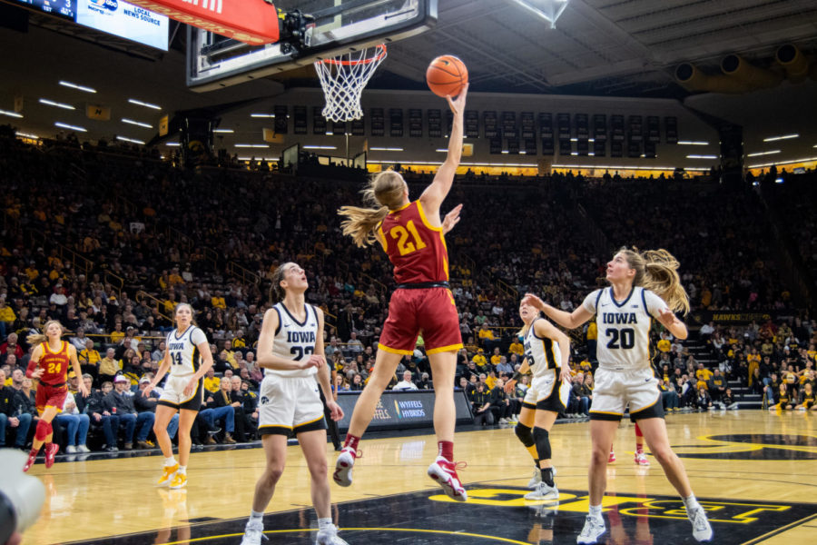 Lexi Donarski jumps to attempt a layup in the game against Iowa at Carver-Hawkeye Arena on Dec. 7, 2022.