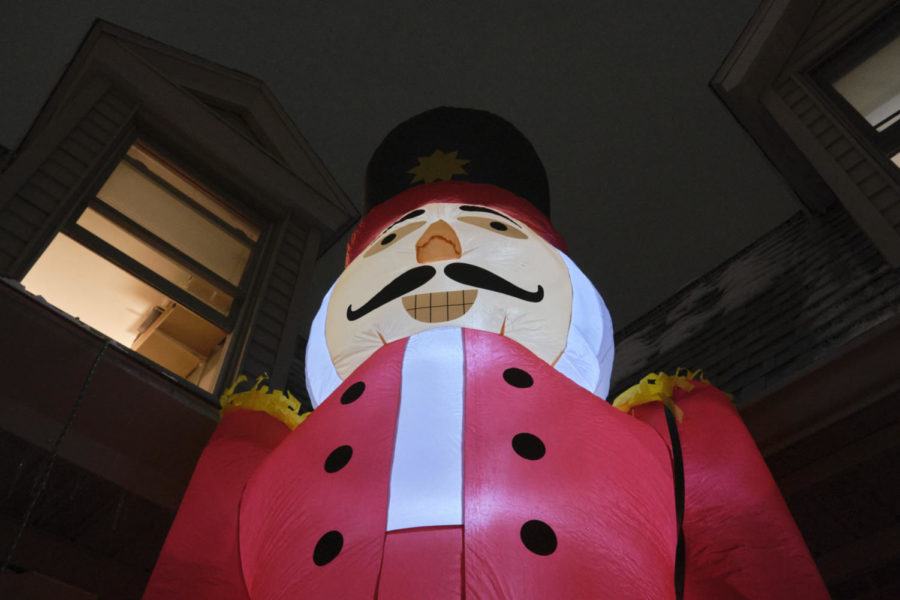 Greg, a 13-foot inflatable nutcracker, guards the rooftop of the Beta Sigma Psi fraternity house. 