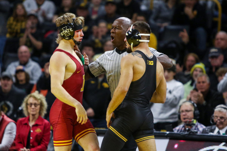 Iowa States Casey Swiderski is seperated from Iowas Real Woods during the CyHawk wrestling dual on Dec. 4, 2022.