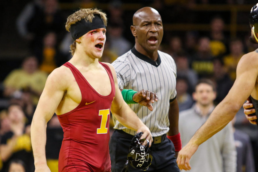 Iowa States Casey Swiderski reacts after falling to Iowas Real Woods during the CyHawk wrestling dual on Dec. 4, 2022.