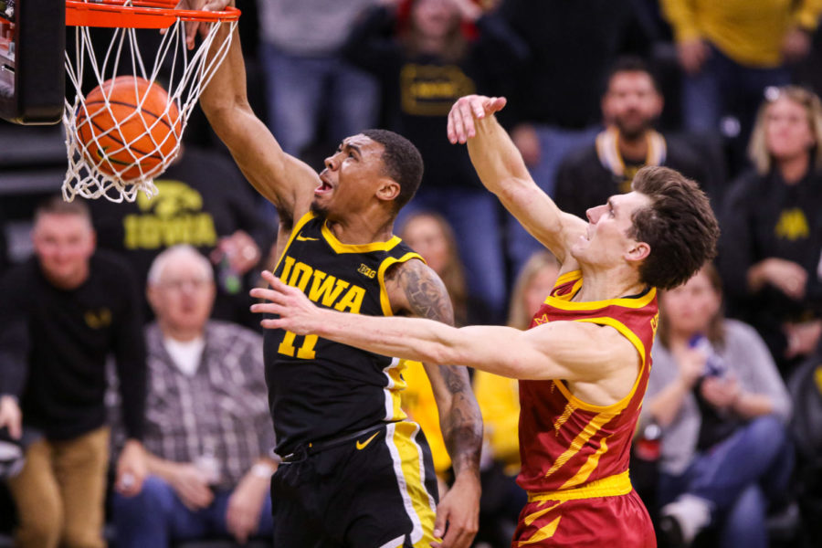 Tony Perkins throws down dunk on Caleb Grill during Cy-Hawk game on Dec. 8.