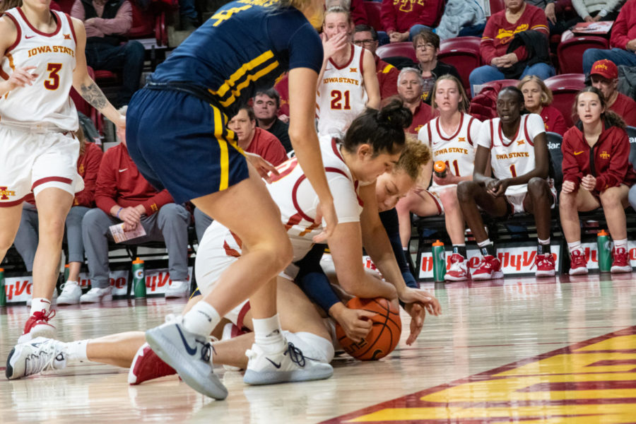 Izzi Zingaro falls on the ball during the game against West Virginia in Hilton Coliseum on Jan. 4th, 2023.