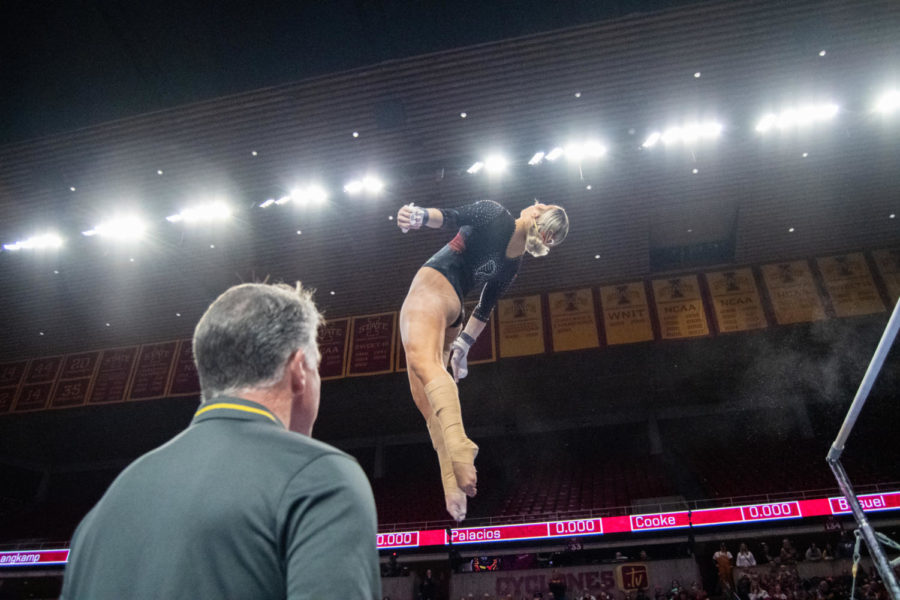 Head+coach+Jay+Ronayne+watches+Lauren+Thomas+finish+her+bars+routine+during+the+meet+against+Eastern+Michigan+and+UC+Davis+in+Hilton+Coliseum+on+Jan.+20%2C+2023.