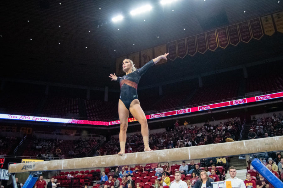 Lauren Thomas poses in her beam routine during the meet against Eastern Michigan and UC Davis in Hilton Coliseum on Jan. 20, 2023.