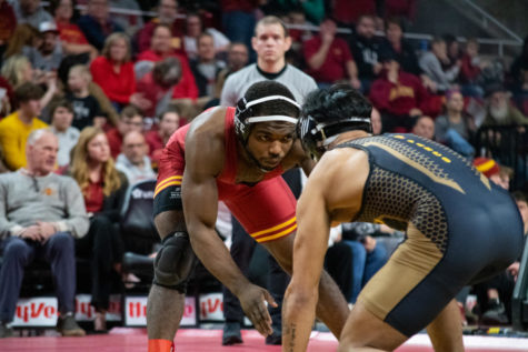 Iowa State's Paniro Johnson stares down Arizona State's Kyle Parco in Hilton Coliseum on Jan. 8, 2023.