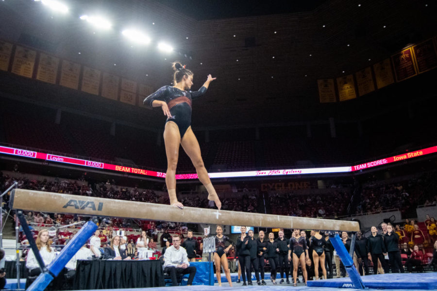 Natalie+Horowitz+strikes+a+pose+in+her+beam+routine+during+the+meet+against+Eastern+Michigan+and+UC+Davis+in+Hilton+Coliseum+on+Jan.+20%2C+2023.