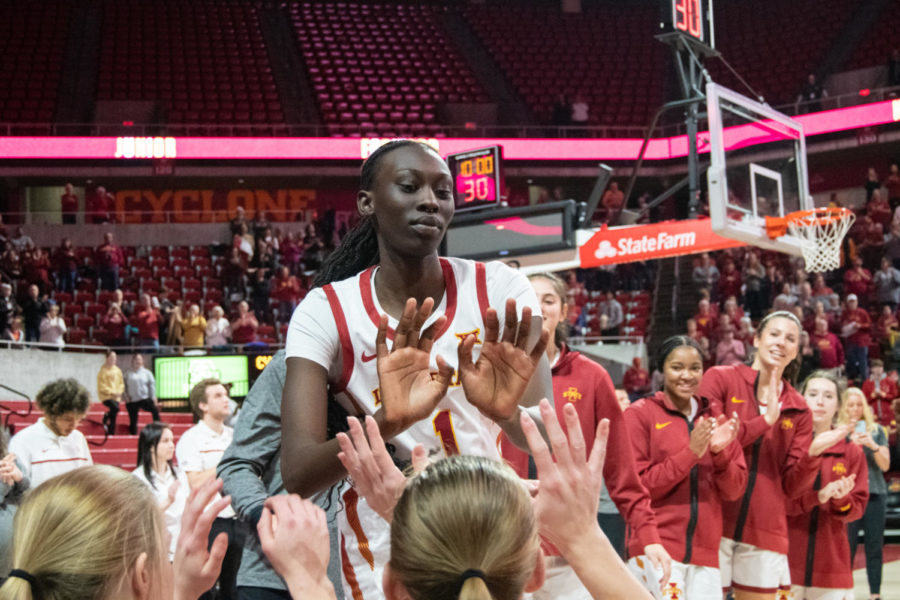 Nyamer+Diew+high-fives+her+teammates+while+her+name+is+announced+before+the+game+against+Kansas+State+in+Hilton+Coliseum+on+Jan.+11%2C+2023.