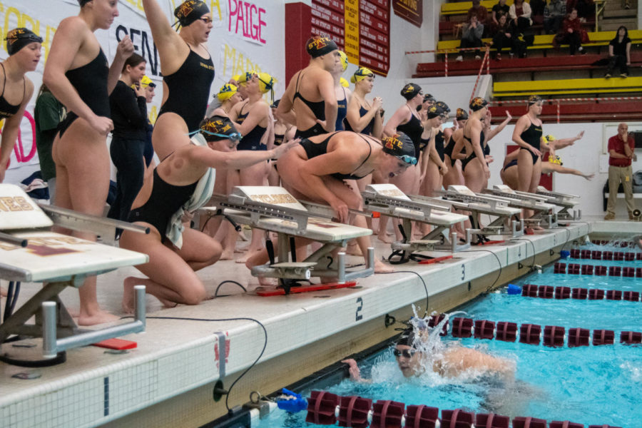 Iowa State swimmers cheer on their teammate during a race against UNI and West Virginia in Beyer Hall on Jan. 21, 2023.