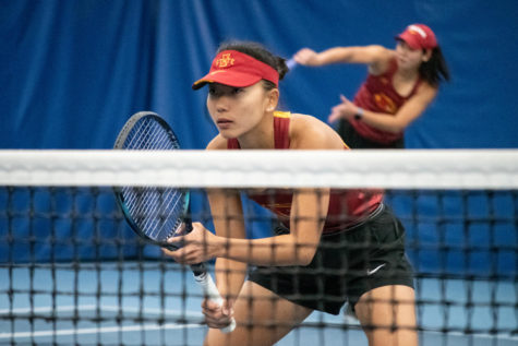 Thasaporn Naklo gets into position as her teammate serves the ball during their match against Drake University at the Roger Knapp Tennis Center on Jan. 14, 2023.