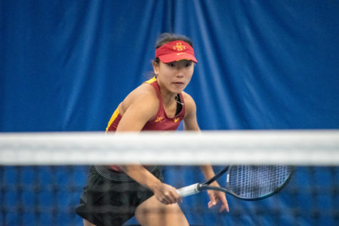 Thasaporn Naklo runs up towards the net to try and get to the ball during her match against Drake University at the Roger Knapp Tennis Center on Jan. 14, 2023.