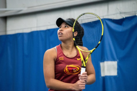 Ange Oby Kajuru prepares to receive the ball during her match against Drake University at the Roger Knapp Tennis Center on Jan. 14, 2023.