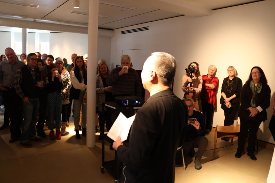 Artist King Au speaks to visitors at the Neva M. Petersen Maquette Gallery in Morill Hall on Jan. 21, 2023.