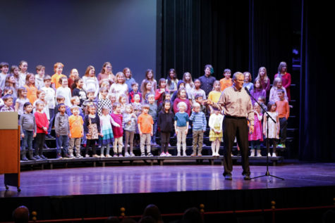 The director of the Meeker Elementary School choir speaks at the Martin Luther King Jr. Day Ames/Story County Community Celebration, Jan. 16. 