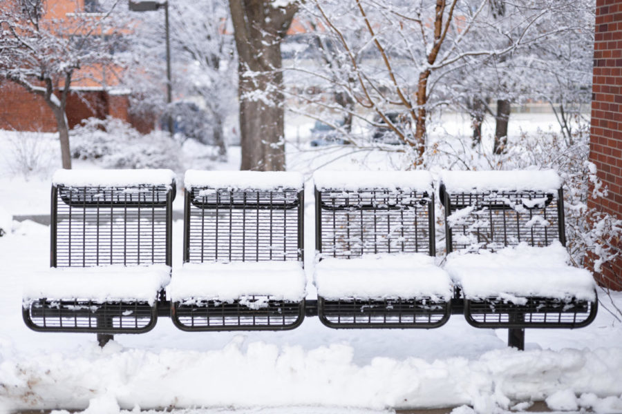 Snow covers the outdoor seating in front of Hamilton Hall, Jan. 19.