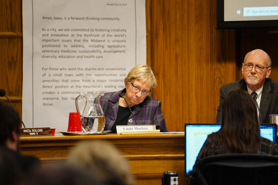 Story County Supervisor Linda Murken and Mayor John Haila listen attentively durring an Ames City Council meeting on Jan. 24. 