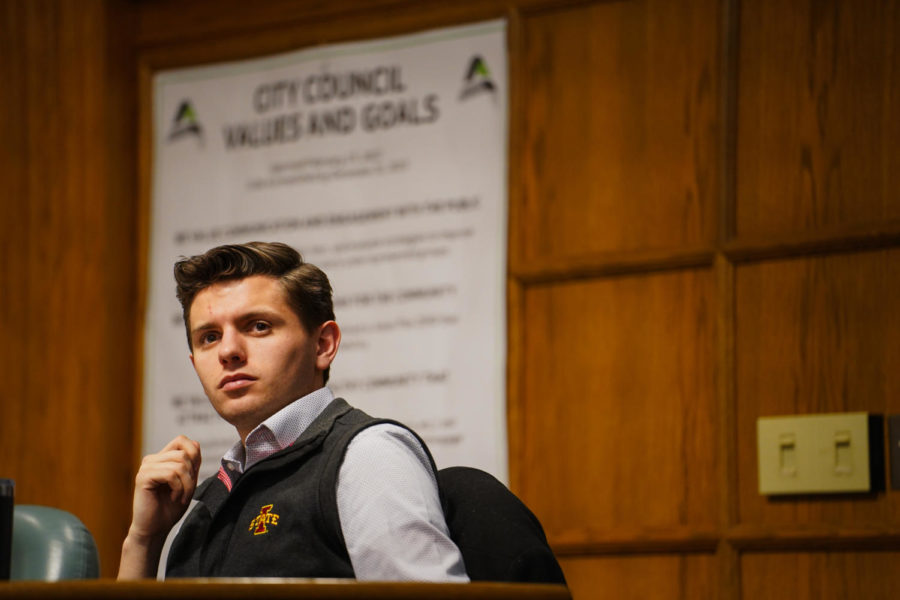 Jacob Ludwig, student body president and a senior a senior double majoring in economics and political science, reacts to a citizens speech at the Ames City Council meeting on Jan. 24. 